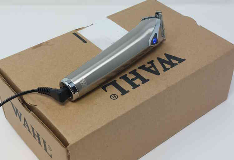 Wahl Stainless Steel Lithium-Ion Beard Trimmer on its box charging