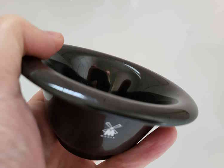holding MÜHLE Porcelain Shaving Bowl with thumb at the top