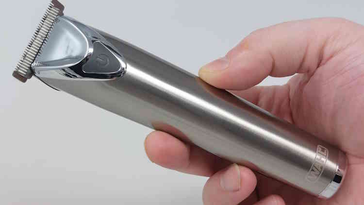 holding the Wahl Stainless Steel Lithium-Ion 2.0 Beard Trimmer to display its ergonomics