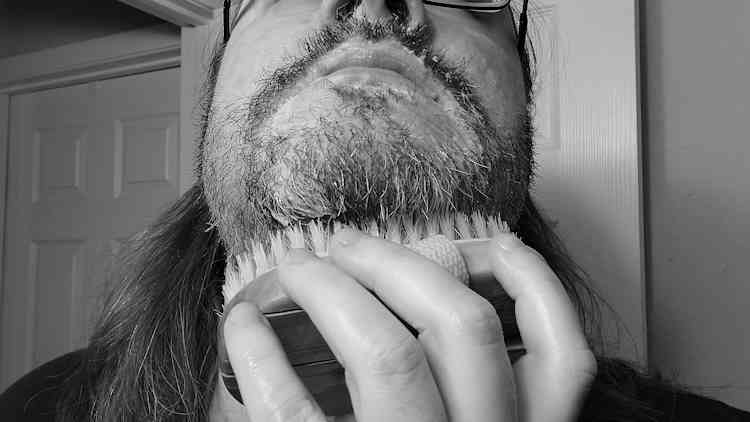 reviewer Robert using the Medicine Man Beard Wash and a brush on his beard