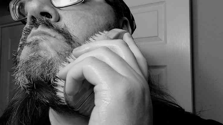 reviewer Robert using the Medicine Man Beard Wash and a brush on his beard