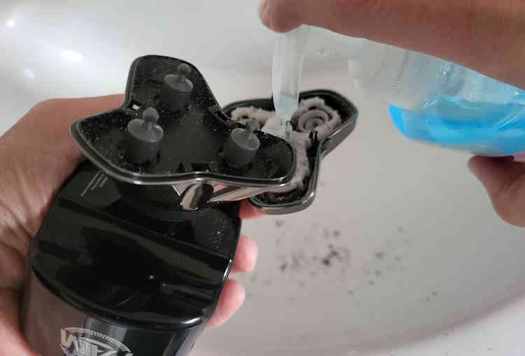 adding anti bacterial soap inside Skull Palm Shaver blades