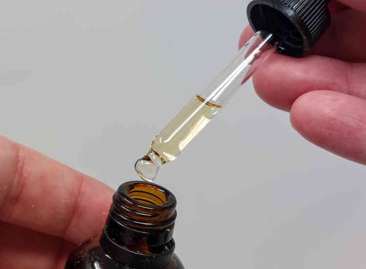 close up of Proraso Beard Oil dropper being filled