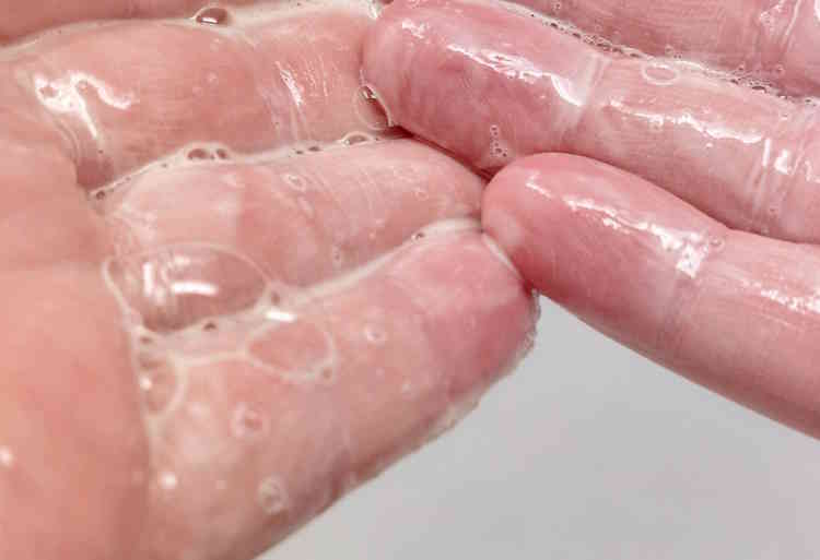 close up of Proraso Beard Wash on hands