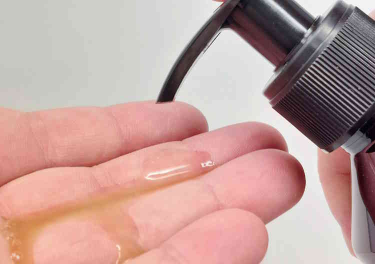 close up of pumping Proraso Beard Wash onto the hand ready to use