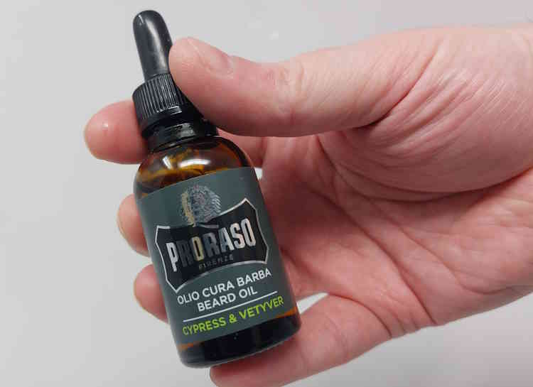 holding Proraso Beard Oil bottle