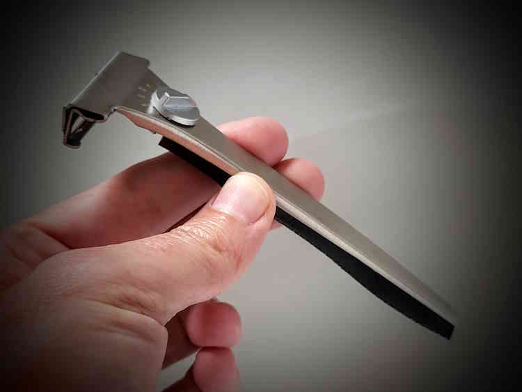 holding a Parker Adjustable Injector Safety Razor to display how it looks