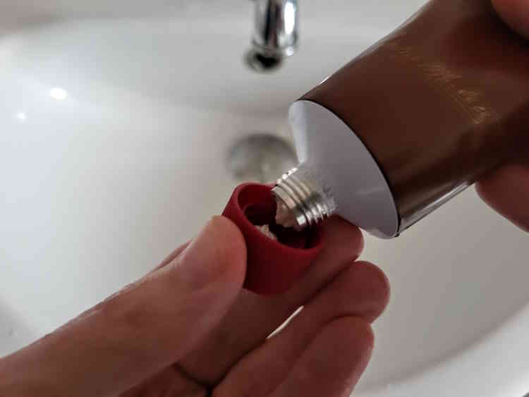 taking the off a tube of Proraso Red shaving cream