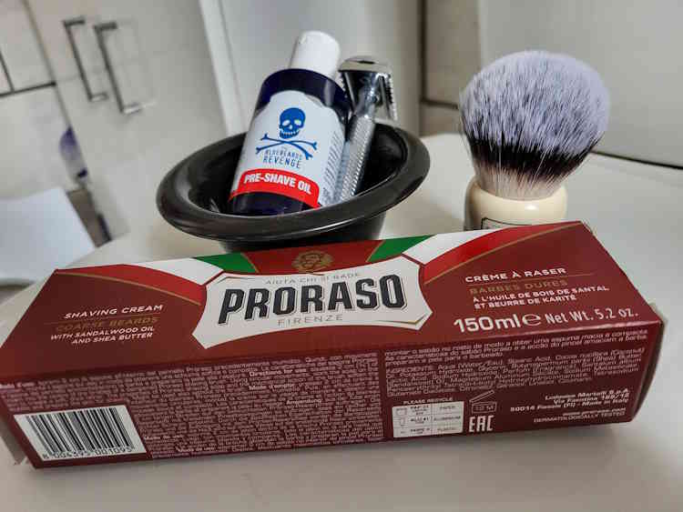 Bluebeards Revenge Pre-Shave Oil with Proraso Red shaving cream and razor on the sink