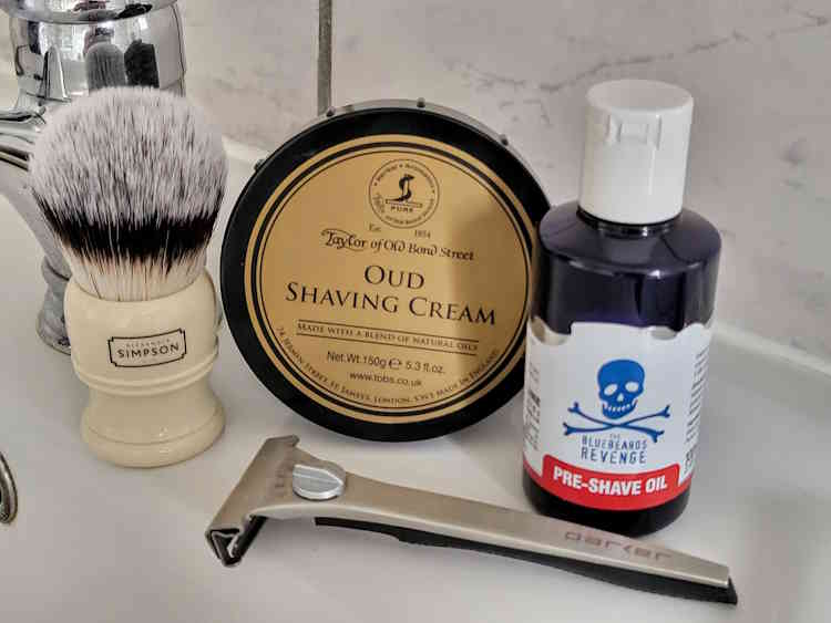 Bluebeards Revenge Pre-Shave Oil with TOBS Oud shaving cream and razor on the sink