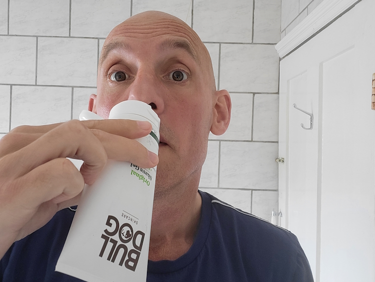 reviewer Jason smelling the scent of Bulldog Original Shave Gel