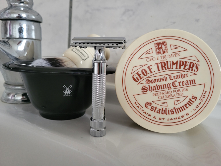 Geo.F. Trumper Spanish Leather Shaving Cream with shaving bowl, safety razor and brush on sink