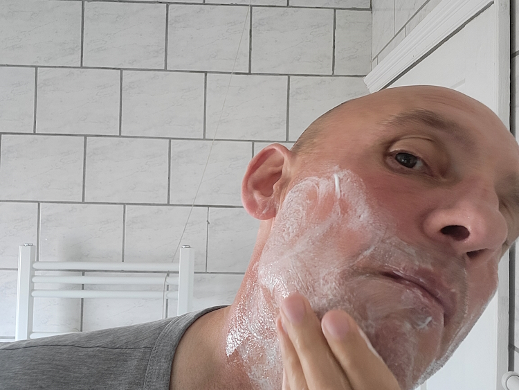 applying King C Gillette Shave Gel on the face showing white effect