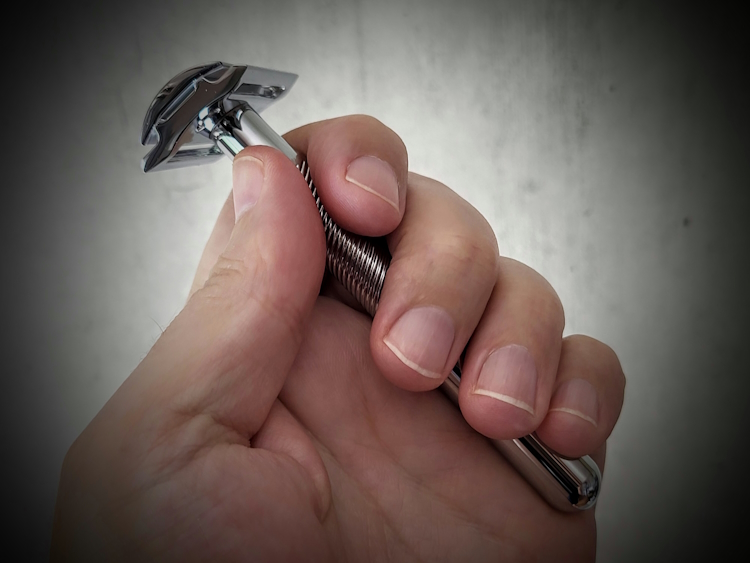 holding a King C. Gillette Razor close up