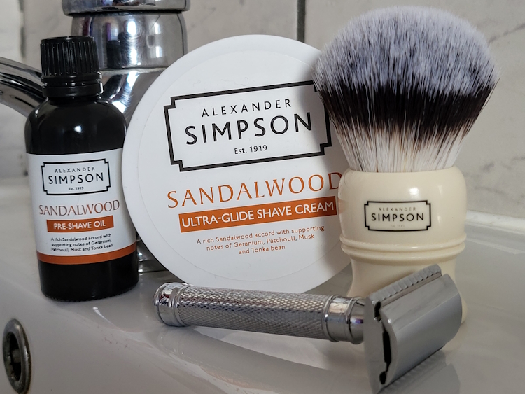 Edwin Jagger DE89 razor on a sink with shaving cream, pre shave oil and a simpsons shaving brush