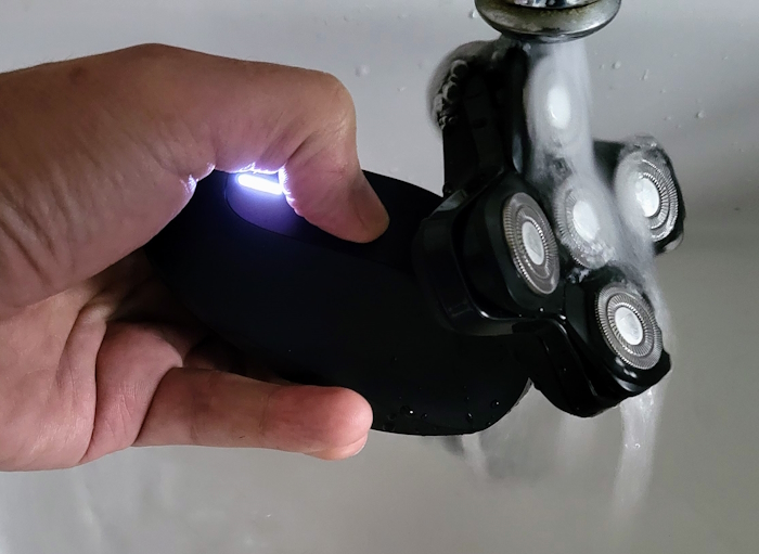 cleaning the Manscaped The Dome Shaver Pro under running water