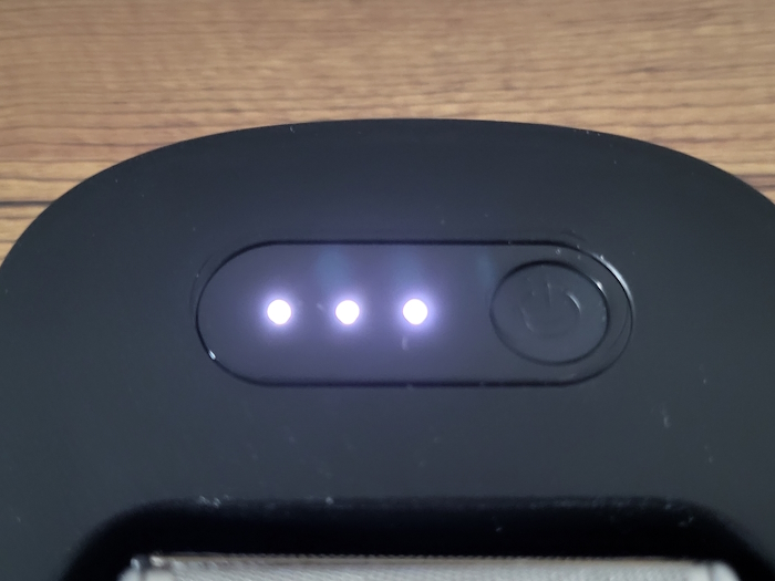 close up of Braun PowerCase power button and LED indicator lights