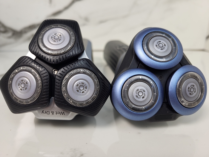 Philips 5000 Series Shaver and Philips 5000x laid down facing forwards showing blade heads