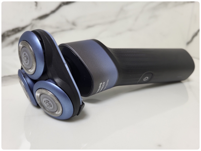 Philips 5000X Shaver laid down with marble background