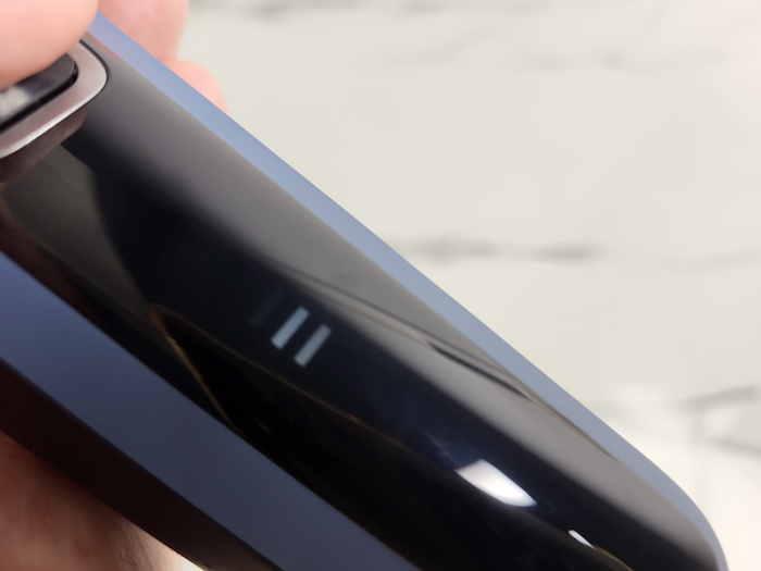 close up of Philips 5000 Series Shaver switched on showing indicator LED light for battery charge left