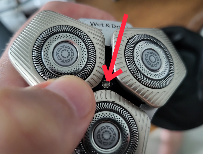 close up of Philips Quick Clean Pod center that connects the shaver to the pod