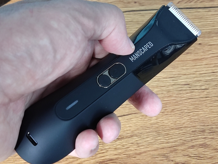 holding the Manscaped Lawn Mower 4.0 Pro