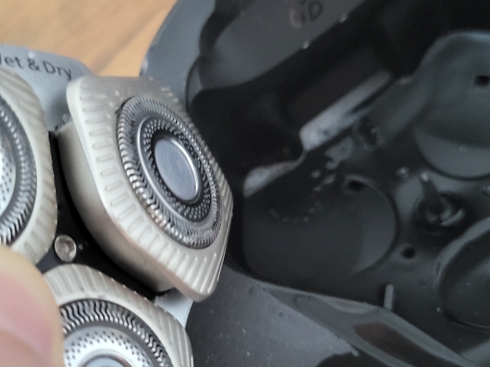 inside the Philips Quick Clean Pod and shaver head after a clean