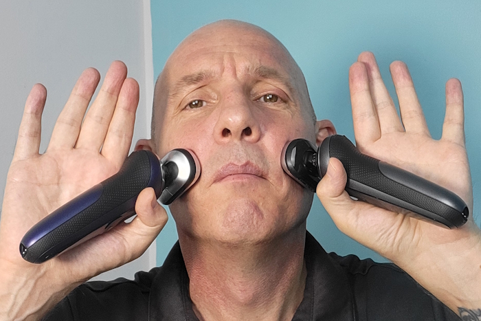 Jason Jones holding the Braun Series 7 standard and trubo mode model ready to shave and compare