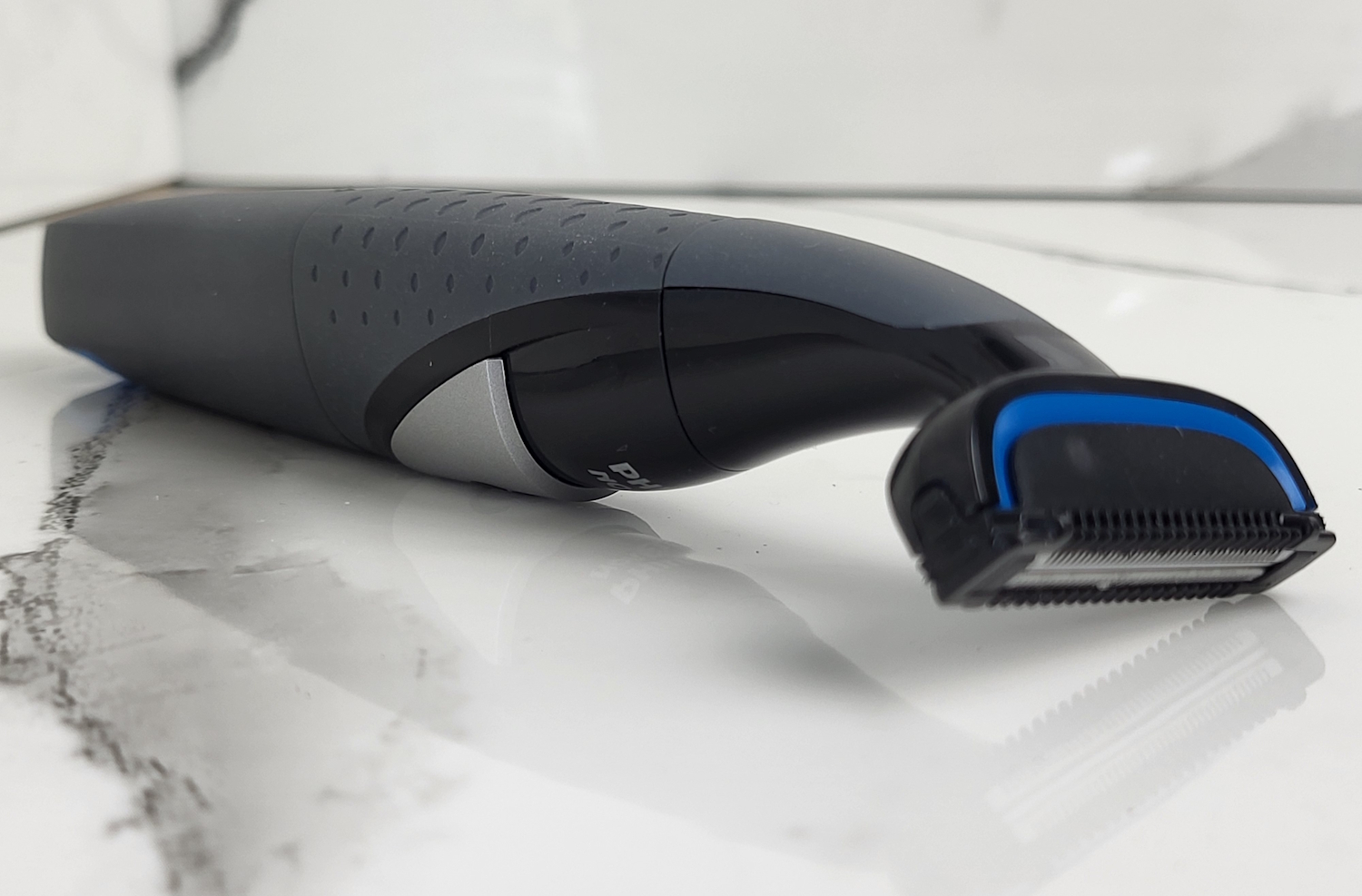 Philips Bodygroom 1100 Series laid down displayed with marble background