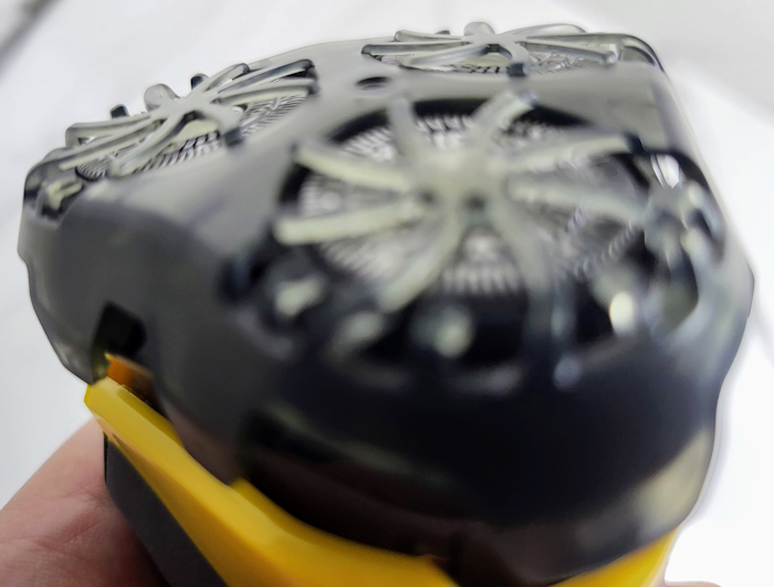 Remington Virtually Indestructible shaver blade cap cover placed on shaver