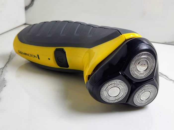 Remington Virtually Indestructible shaver laid on its side displayed