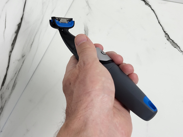 holding the Philips Bodygroom 1100