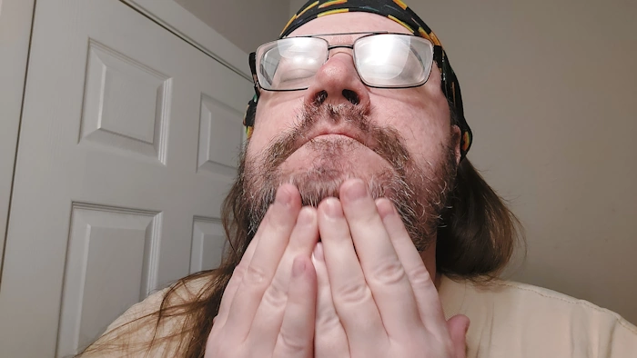 Robert using and applying the SheaMoisture Beard Conditioning oil