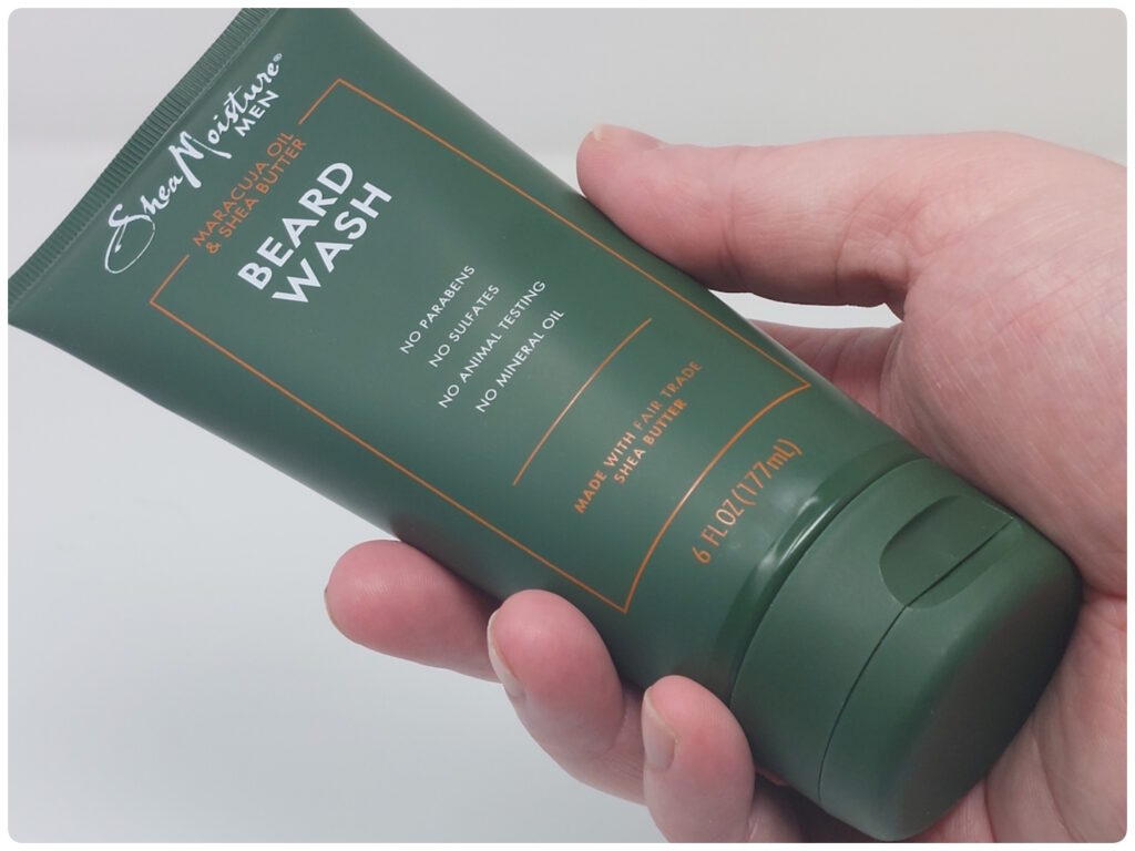 holding SheaMoisture Beard wash tube