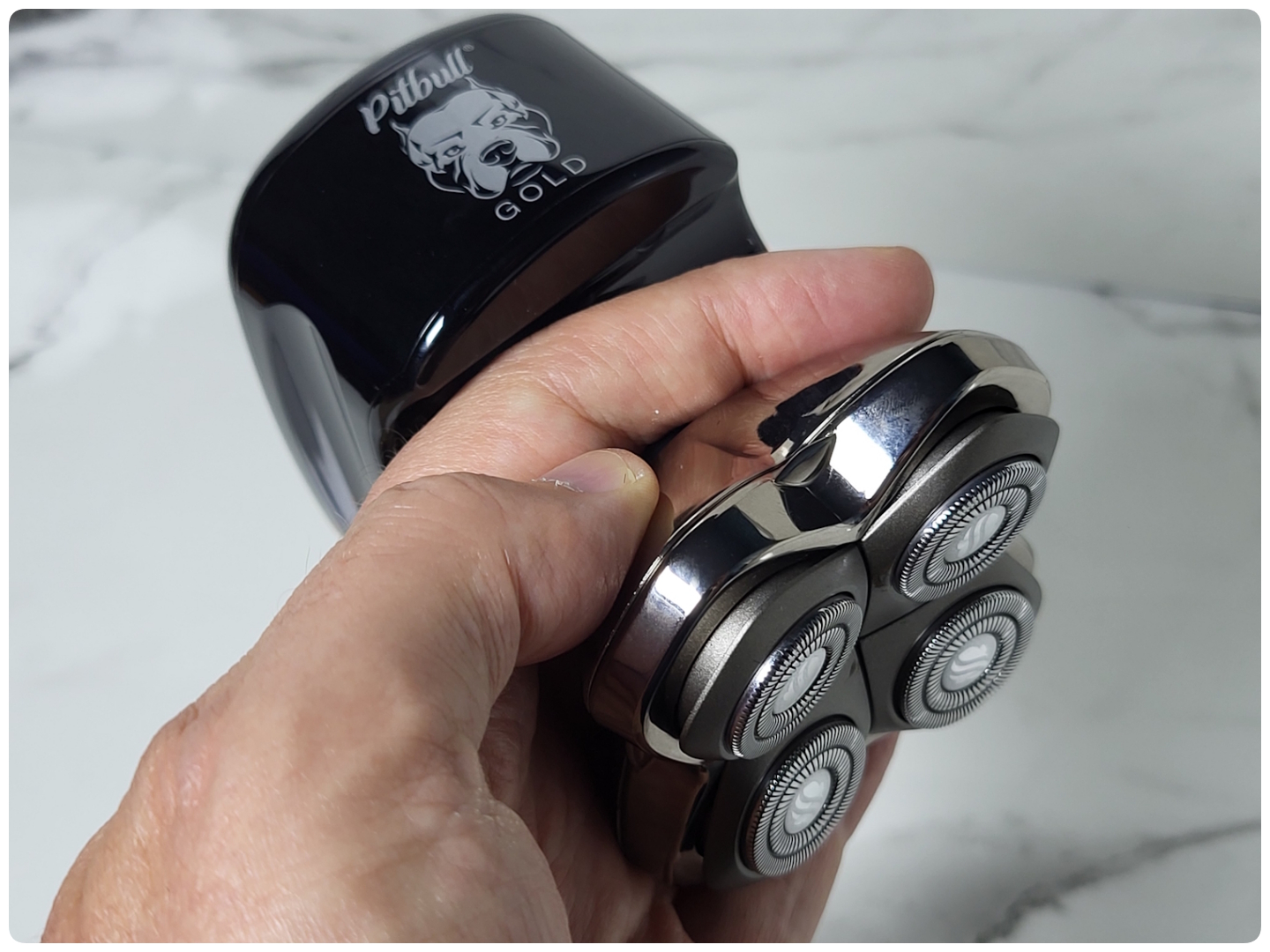 holding the Skull Shaver Pitbull Gold Pro GX5