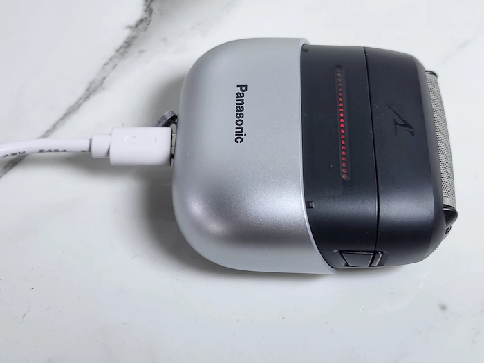 Panasonic ES-CM3 Swipe Shaver on charge showing red LED light