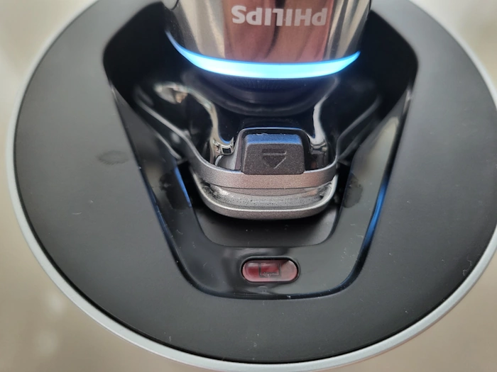 close up of Philips i9000 Prestige cleaning inside the Quick Clean Pod