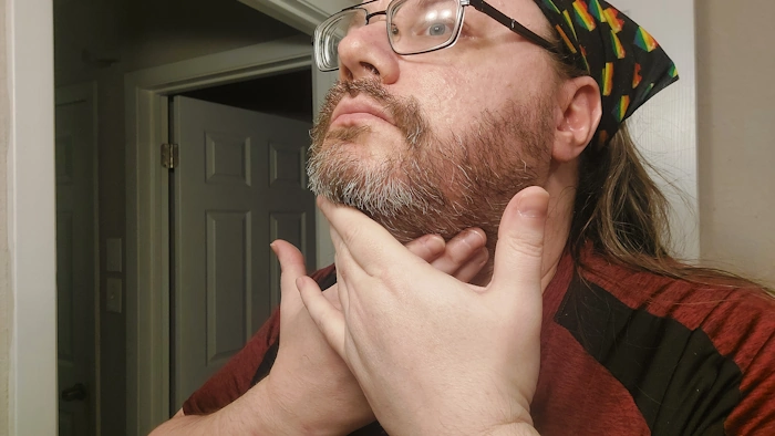 Robert massaging Scotch Porter Beard Oil into his beard