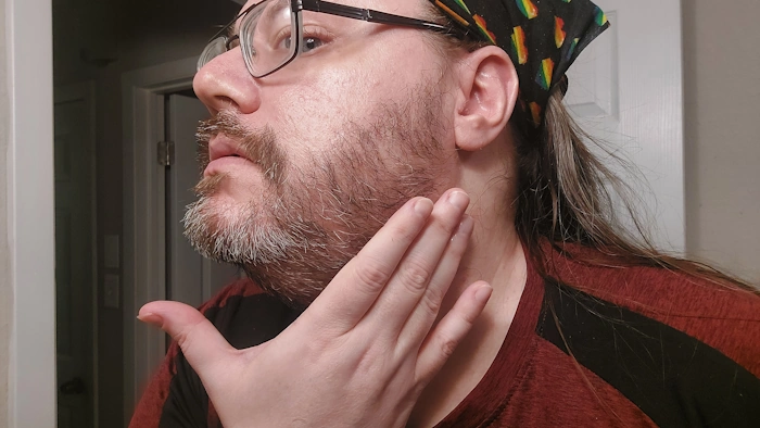 Robert massaging Scotch Porter Beard Oil into his beard