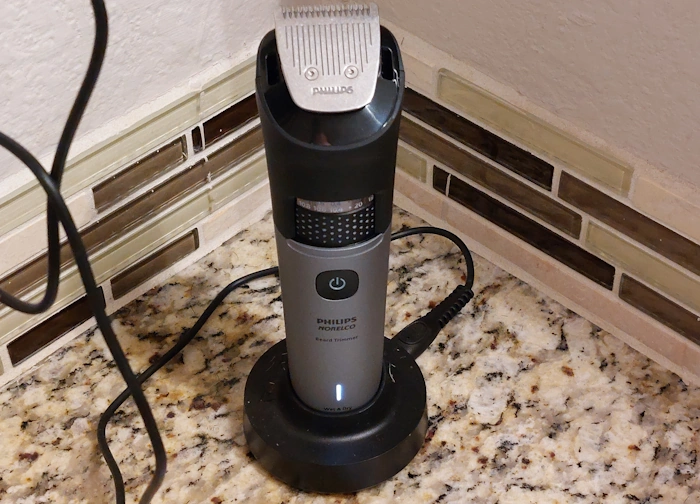 Philips Norelco Series 7000 Beard Trimmer connected to its power cord on charge