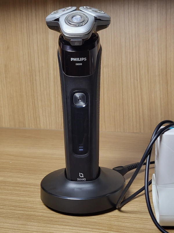 Philips X9000 in its charger stand charging