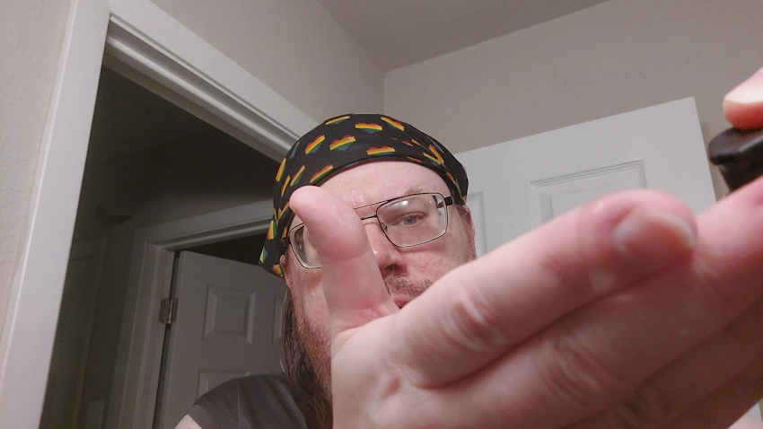 Robert Squirting Manscaped Beard Oil on his hand