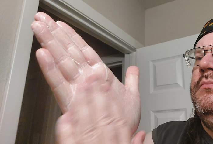 Robert lathering Manscaped Beard Shampoo in his hands