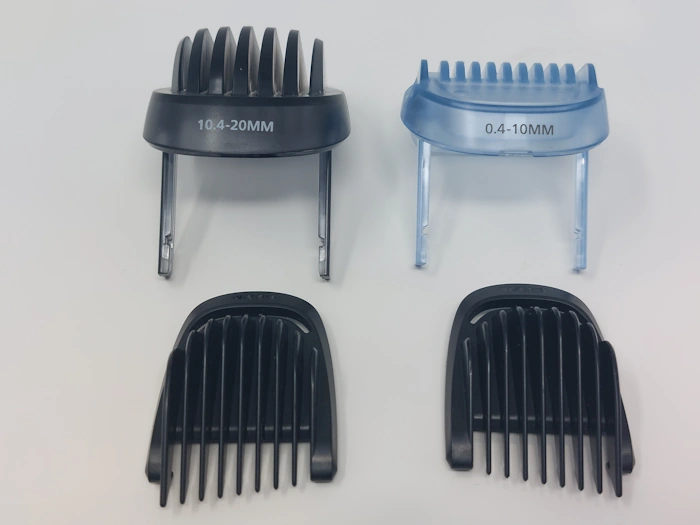 four Philips Norelco Series 7000 Beard Trimmer Guide Combs laid out