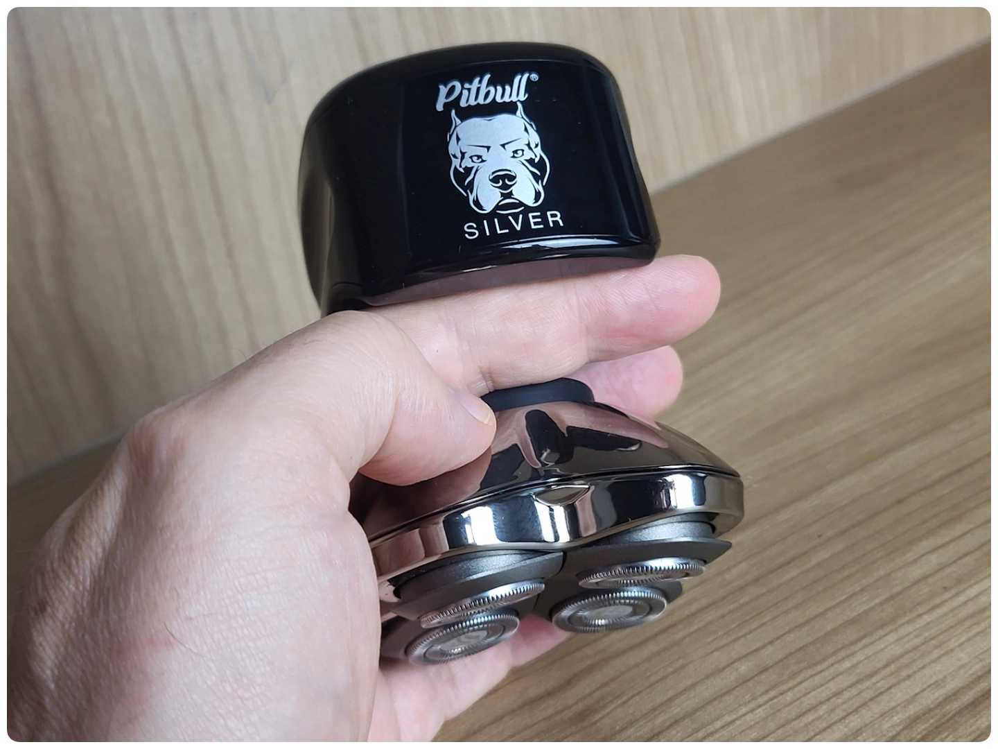 holding the Pitbull Silver Pro SX5 in the cupping method