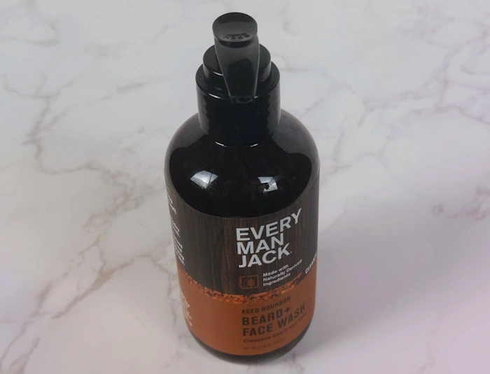 Every Man Jack Aged Bourbon Beard Wash with marble background