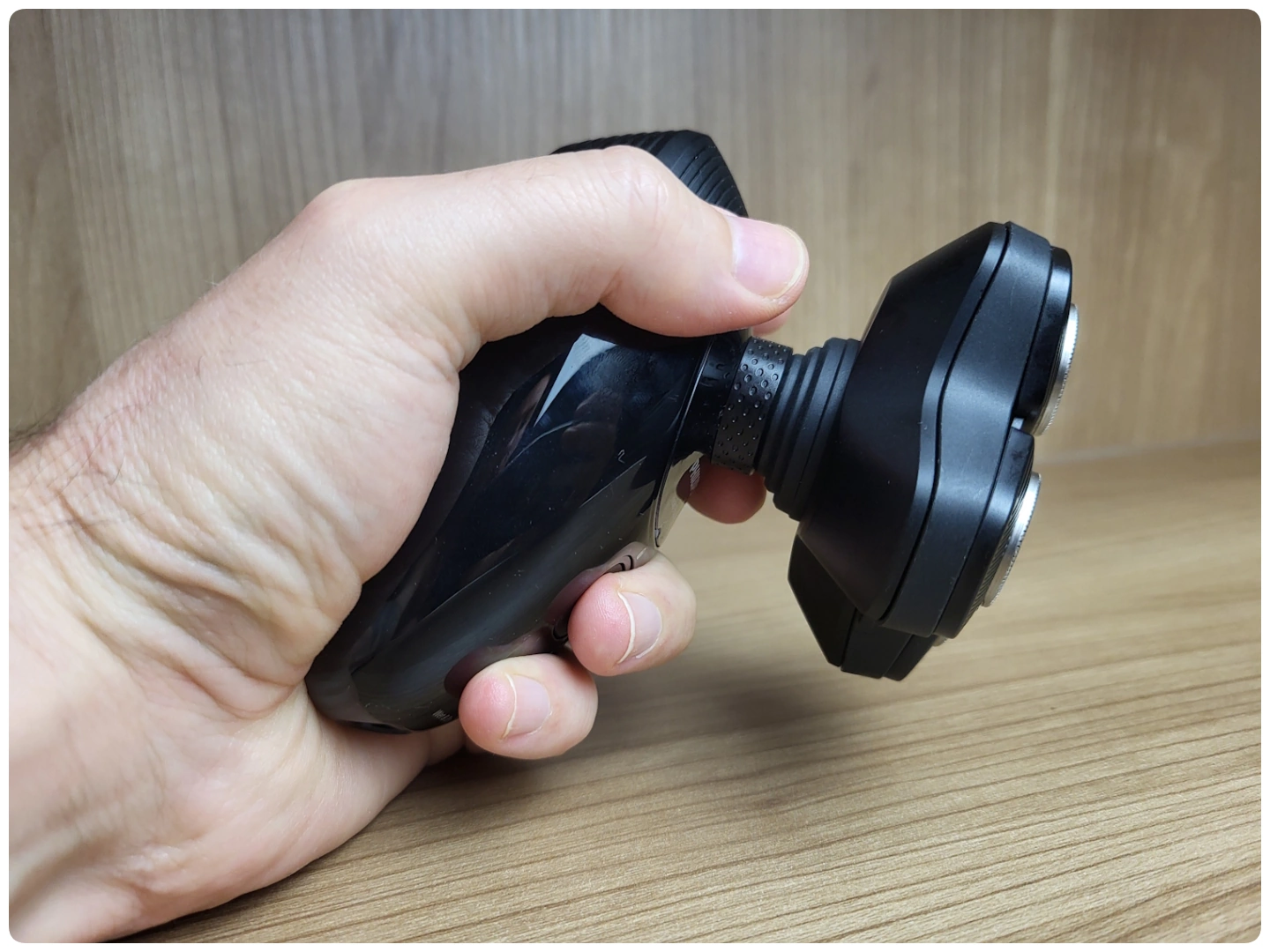 holding the Philips Head Shaver Pro 5000 Series