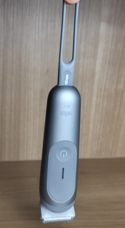 shower cord attached on Braun Body Groomer Series 7 and hanging it to display how it works