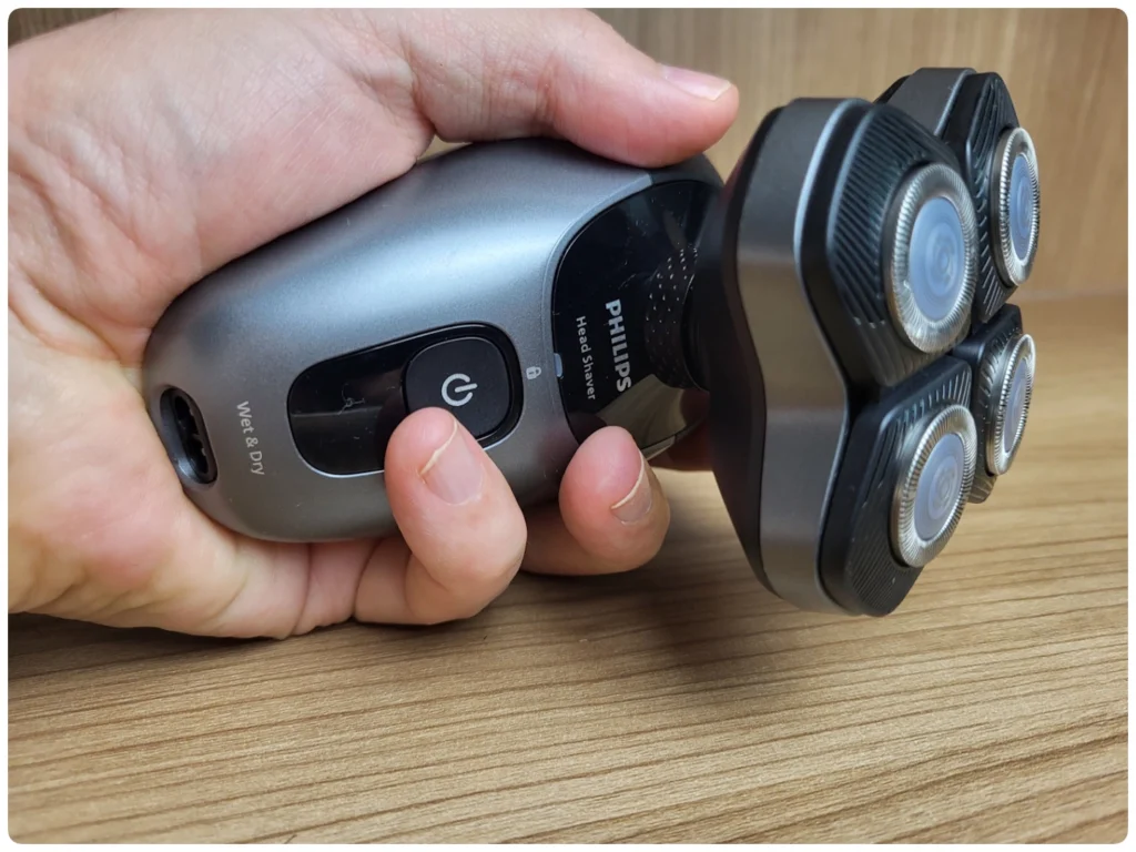 holding the Philips Head Shaver pro 7000 Series
