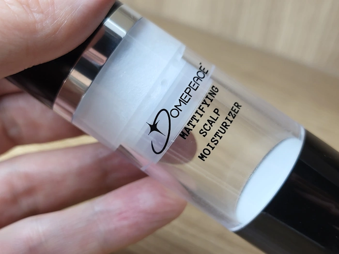 close up showing how much Domepeace Mattifying Moisturizer lotion is left in the bottle